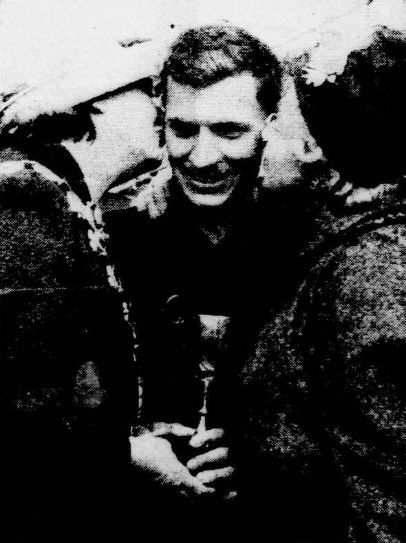 Brian Woolford winner of the Manchester Evening News Cup is kissed during the presentation by Miss Olive Taylor and Mrs. Margaret Young