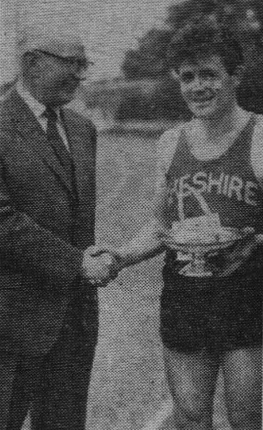 Wallasey athlete Ron barlow and Cheshire County representative, with Mr. George Lambert lines manager of British Railways' Manchester. Taken after Ron Barlow of the Wallasey Athletic Club, was runner-up to the British Olympic probable, Ron Hill in the two mile invitation race at the British Railways L.M.R. Region athletic meeting at Earlestown on 7/6/1964