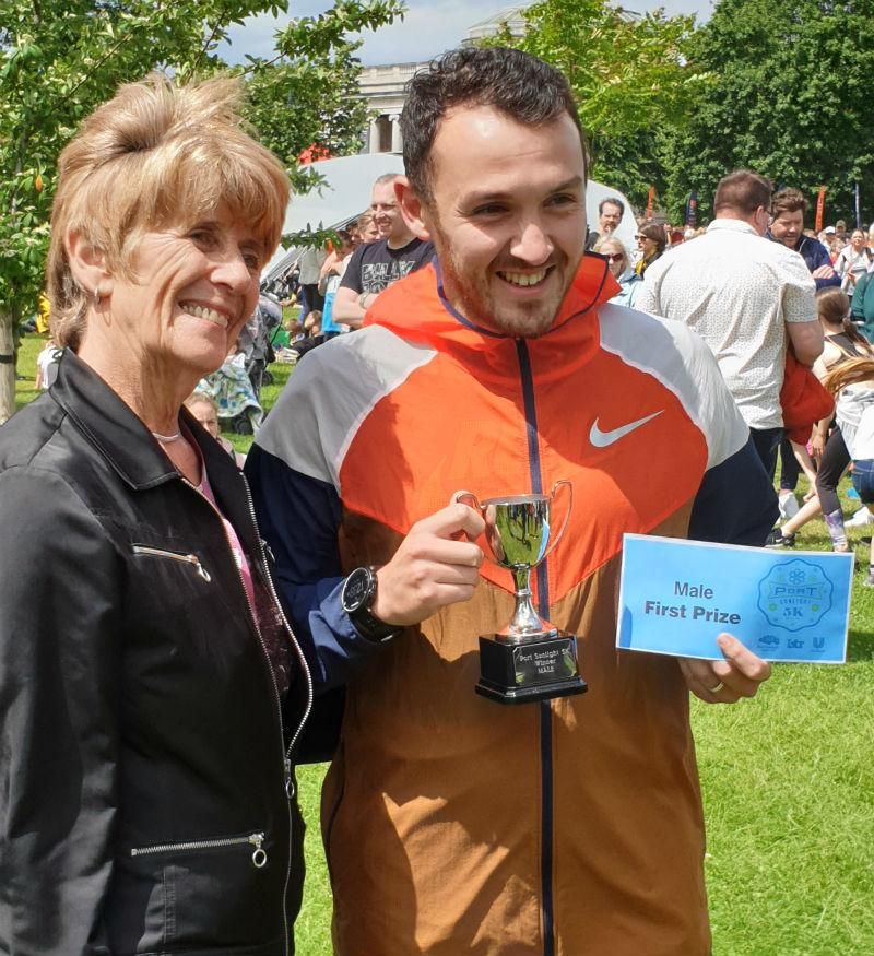 Men's 5k winner Joe Boden with his trophy
