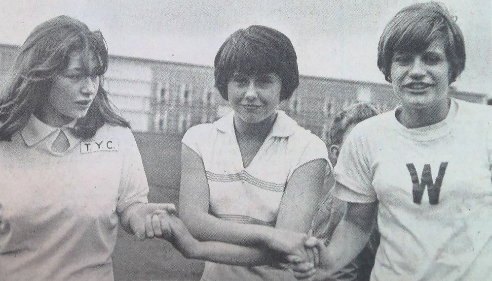 Pat Robertson (centre), 11/2-mile race winner, receives the congratulations of Pamela Hughes (left) and Janet Cash.